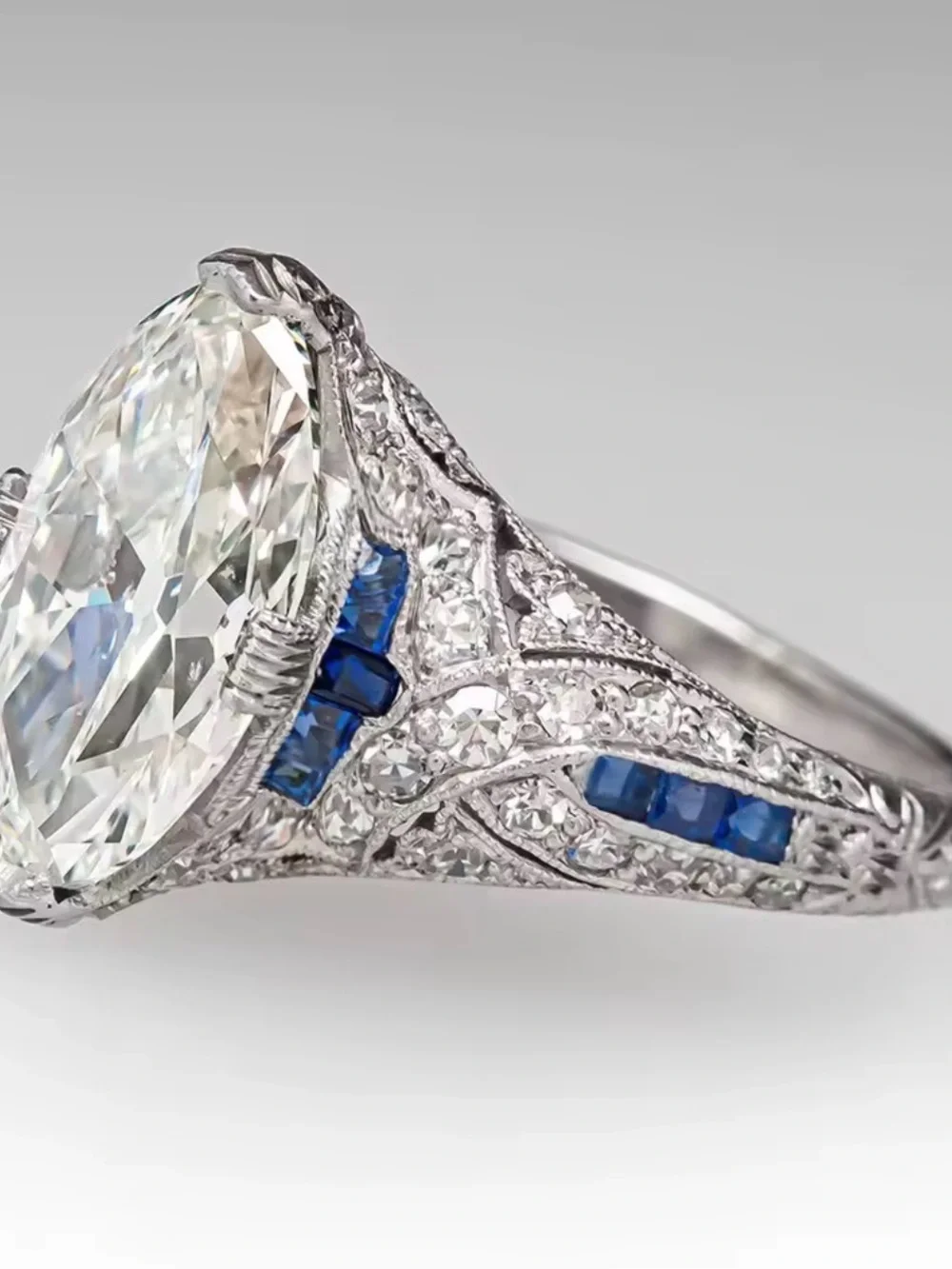 Vintage-Style White Diamond Navette Ring with Blue Accents